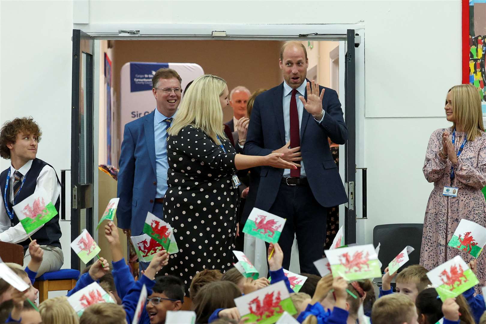 William is welcomed to the school by cheering pupils (Phil Noble/PA)