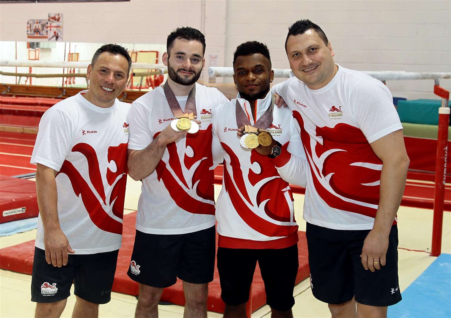 James Hall and Courtney Tulloch with Pegasus coaches Ionut Trandaburu, left, and Ovi Rugina Picture: Sean Aidan