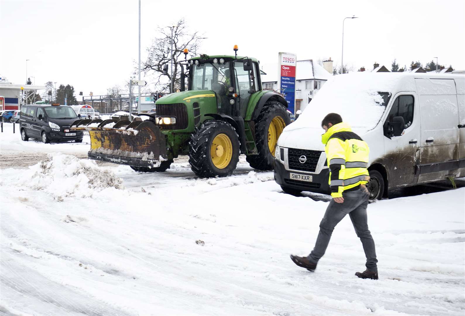 A tractor clears a supermarket car park (Jane Barlow/PA)