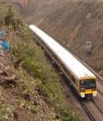 The steep embankment drops 60ft down to the railway line below