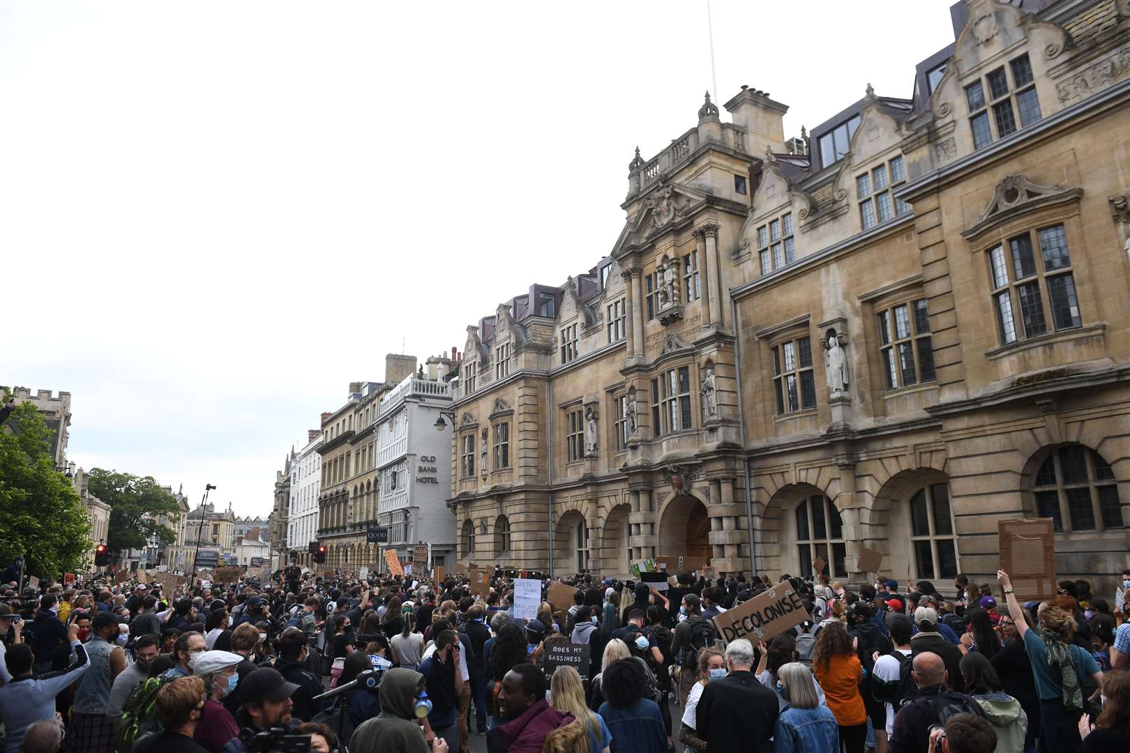 Protesters in front of Oriel College, Oxford, beneath the statue of Cecil Rhodes (Joe Giddens/PA)