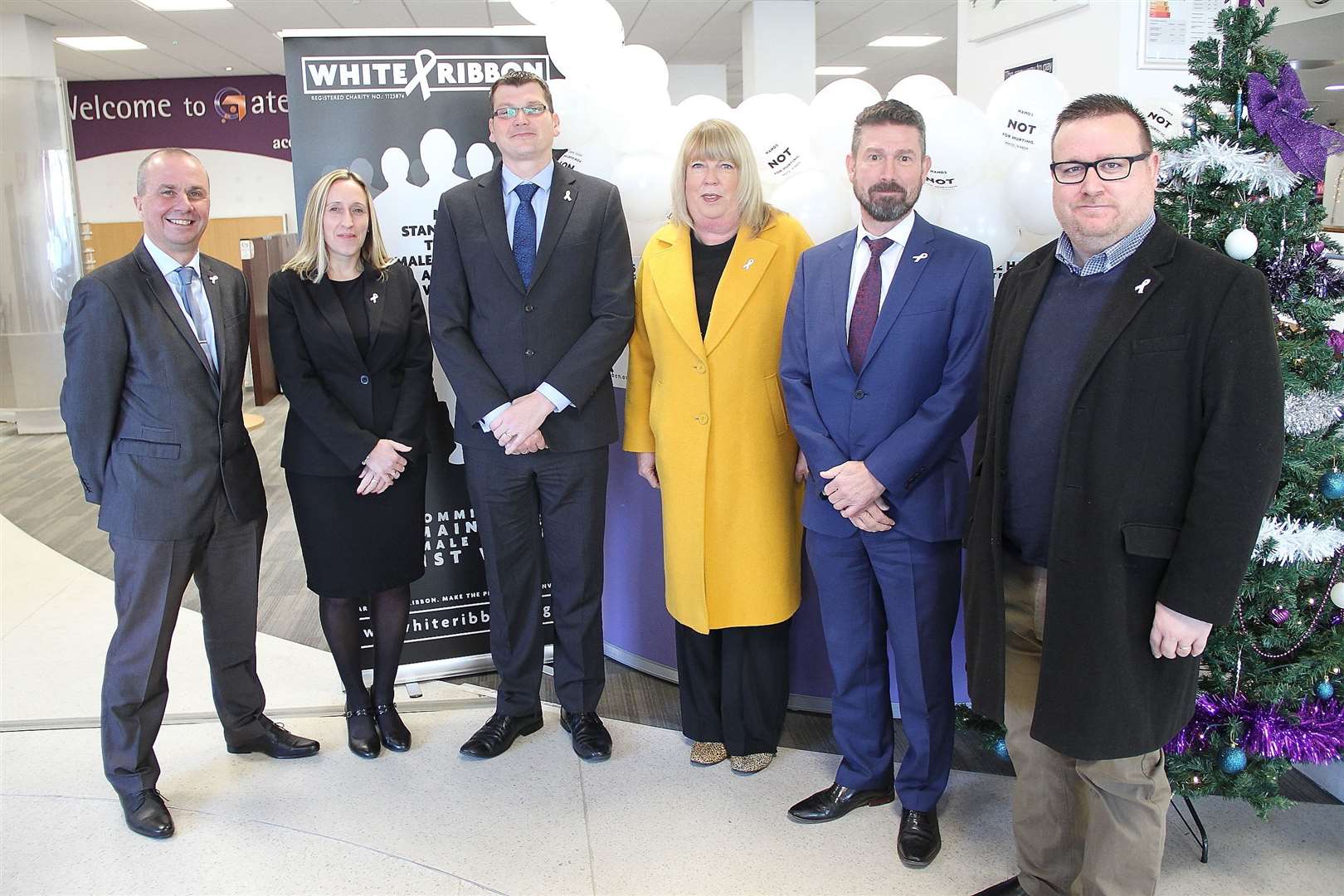 Gravesham Borough Council White Ribbon champions and ambassadors: From left: communications manager Andy Rayfield, director of corporate services Sarah Parfitt, chief executive Stuart Bobby, communities director Melanie Norris, deputy chief executive and housing and operations director Nick Brown, and cabinet member for community and leisure Cllr Shane Mochrie-Cox. Picture: Gravesham council