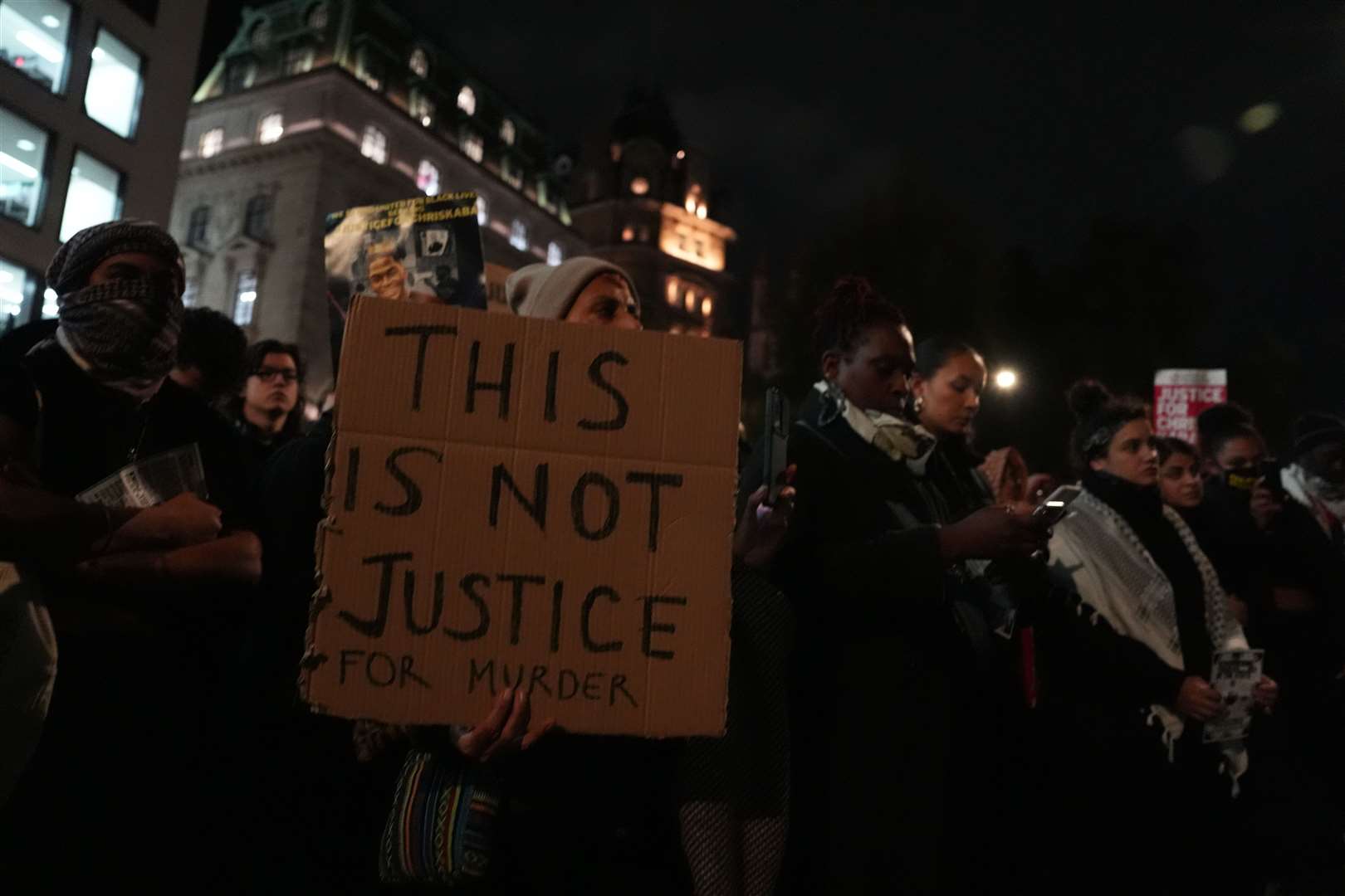 Demonstrators held signs that read ‘This is not justice’ as they protested against the acquittal of a police marksman (Jordan Pettitt/PA)