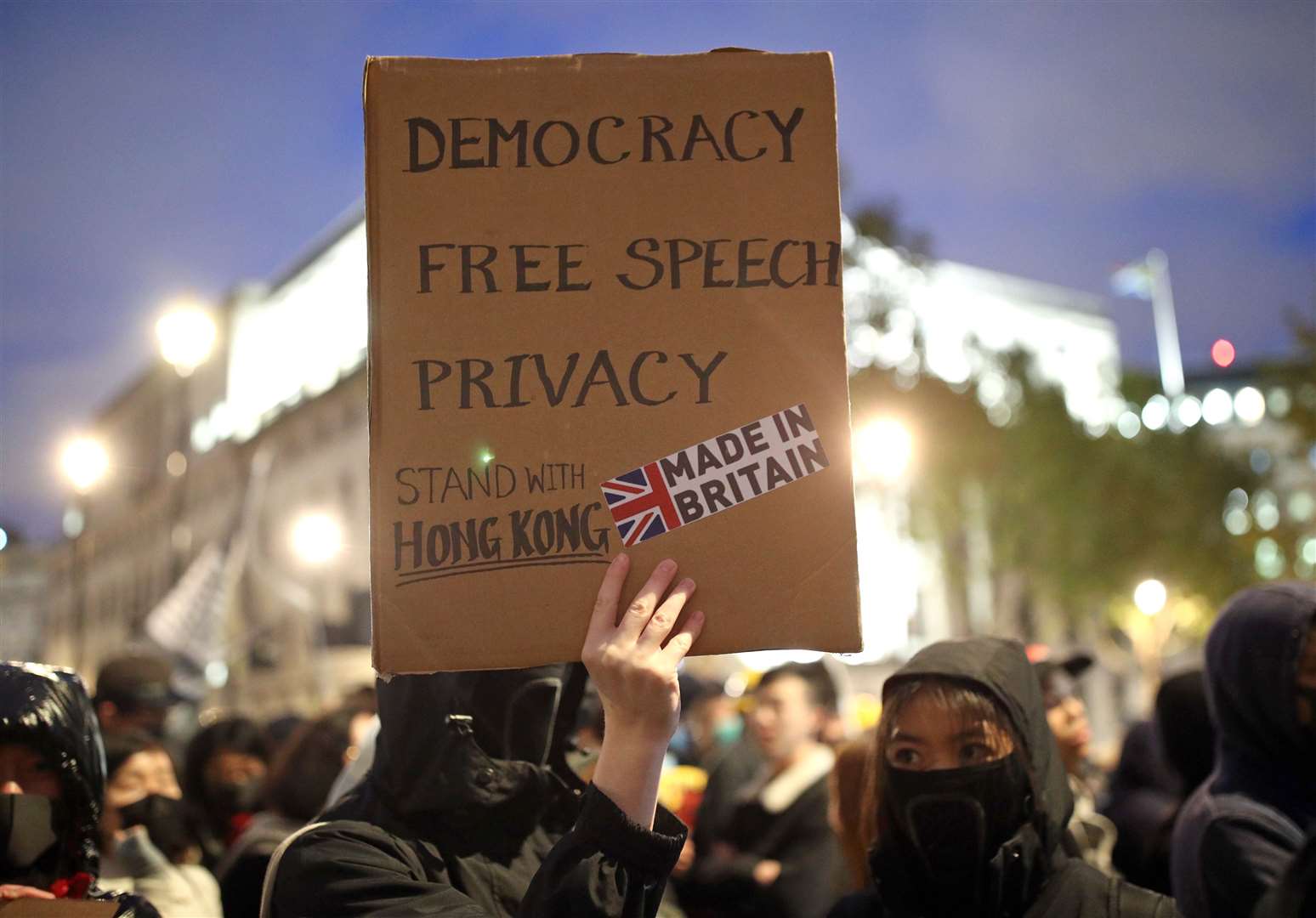 Hong Kong pro-democracy protesters taking part in a Hong Kong solidarity rally in Trafalgar Square, London (Yui Mok/PA)