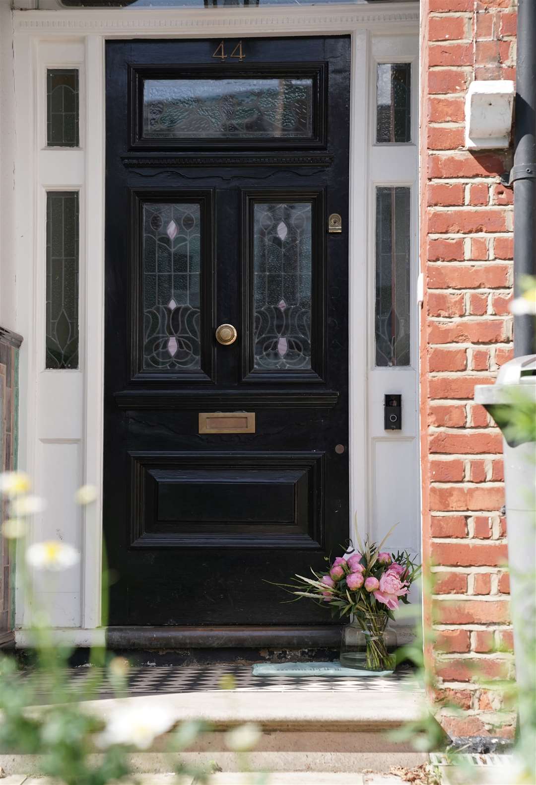 Flowers are left on the doorstep of the north-west London home of Matt Hancock (Aaron Chown/PA)