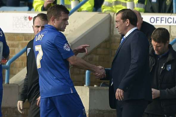 Injured Doug Loft is consoled by manager Justin Edinburgh on Saturday Picture: Barry Goodwin