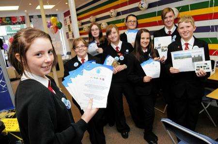 Pupils staffing the new shop, with information and leaflets to hand.