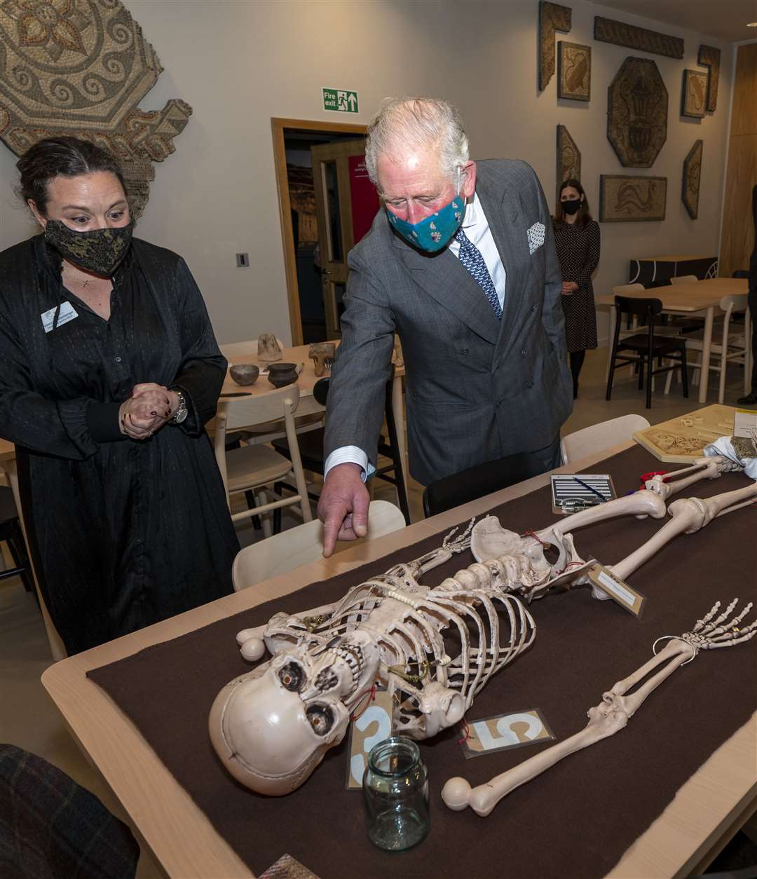 The prince studies a skeleton at the Corinium Museum (Arthur Edwards/The Sun/PA)