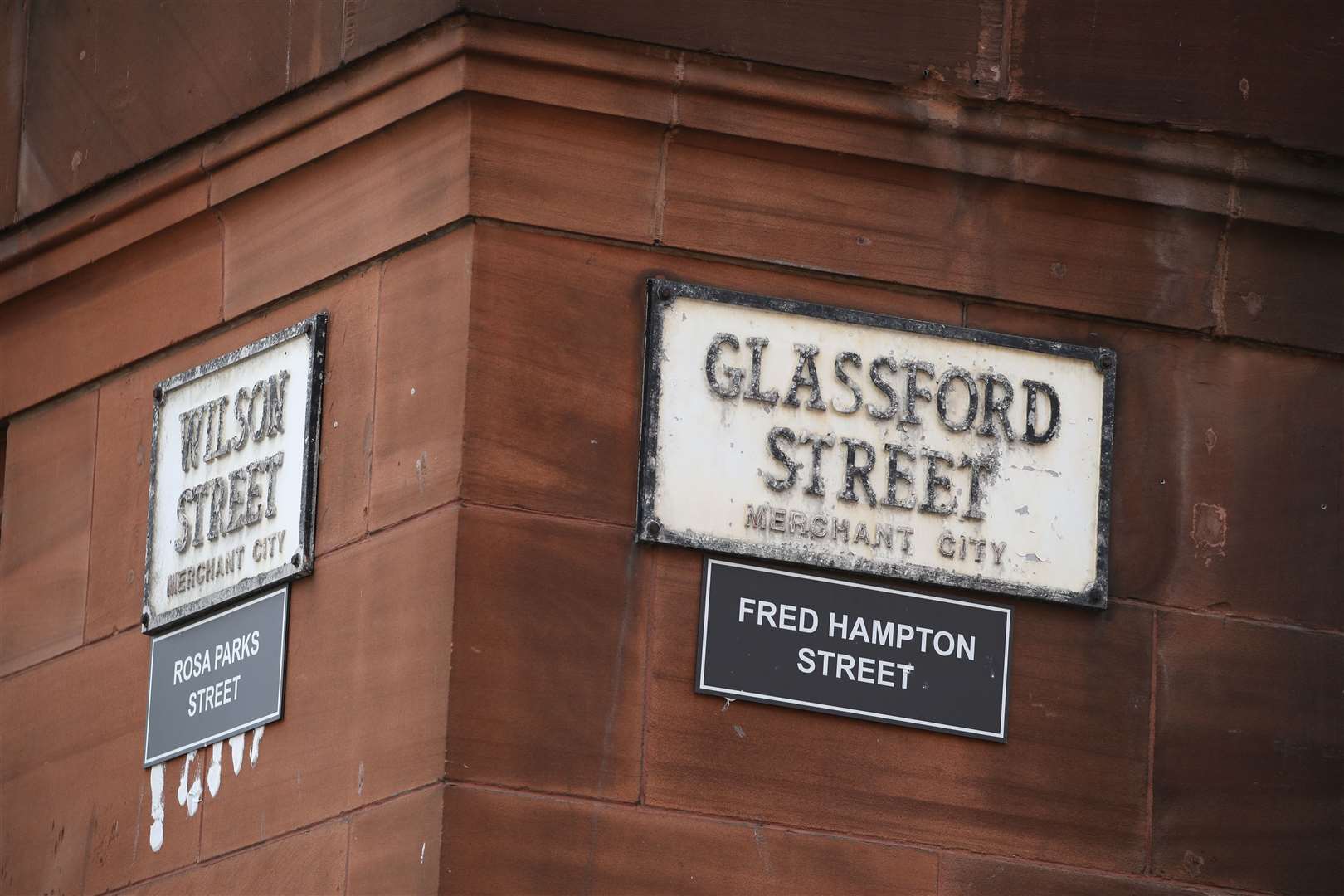 A sign alternatively naming Wilson Street ‘Rosa Parks Street’ and Glassford Street ‘Fred Hampton Street’ in Glasgow (PA)