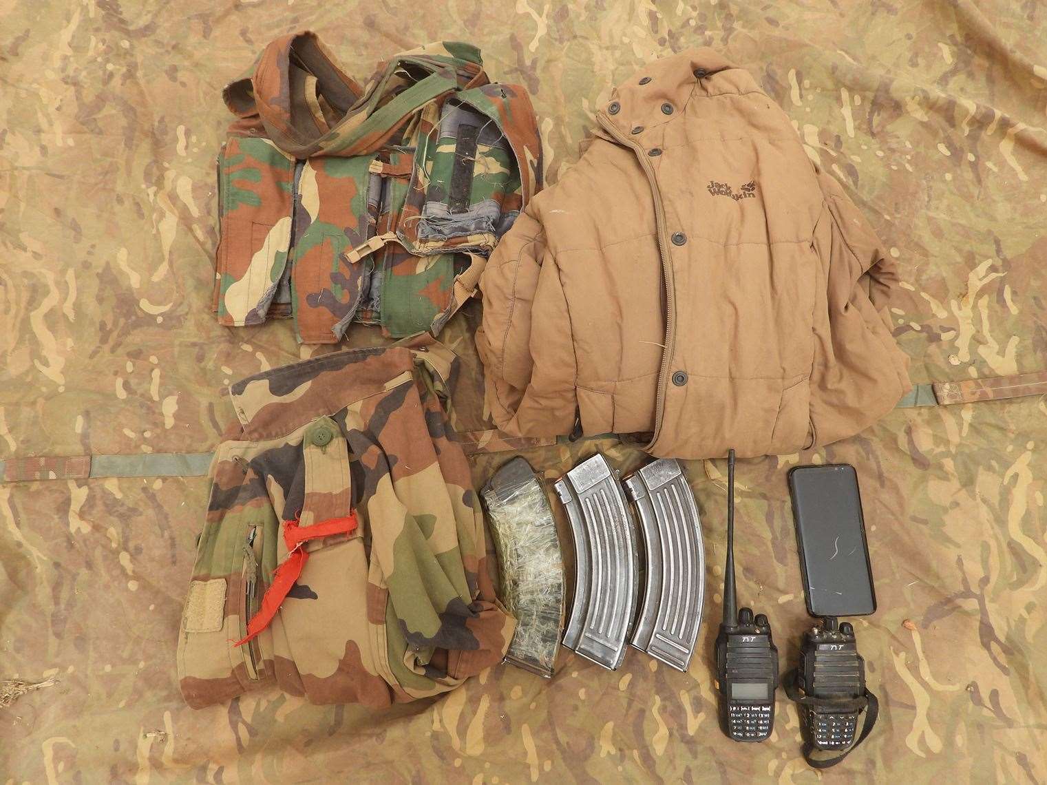 Camouflage clothing, radios and ammunition were also found (Ministry of Defence/PA)