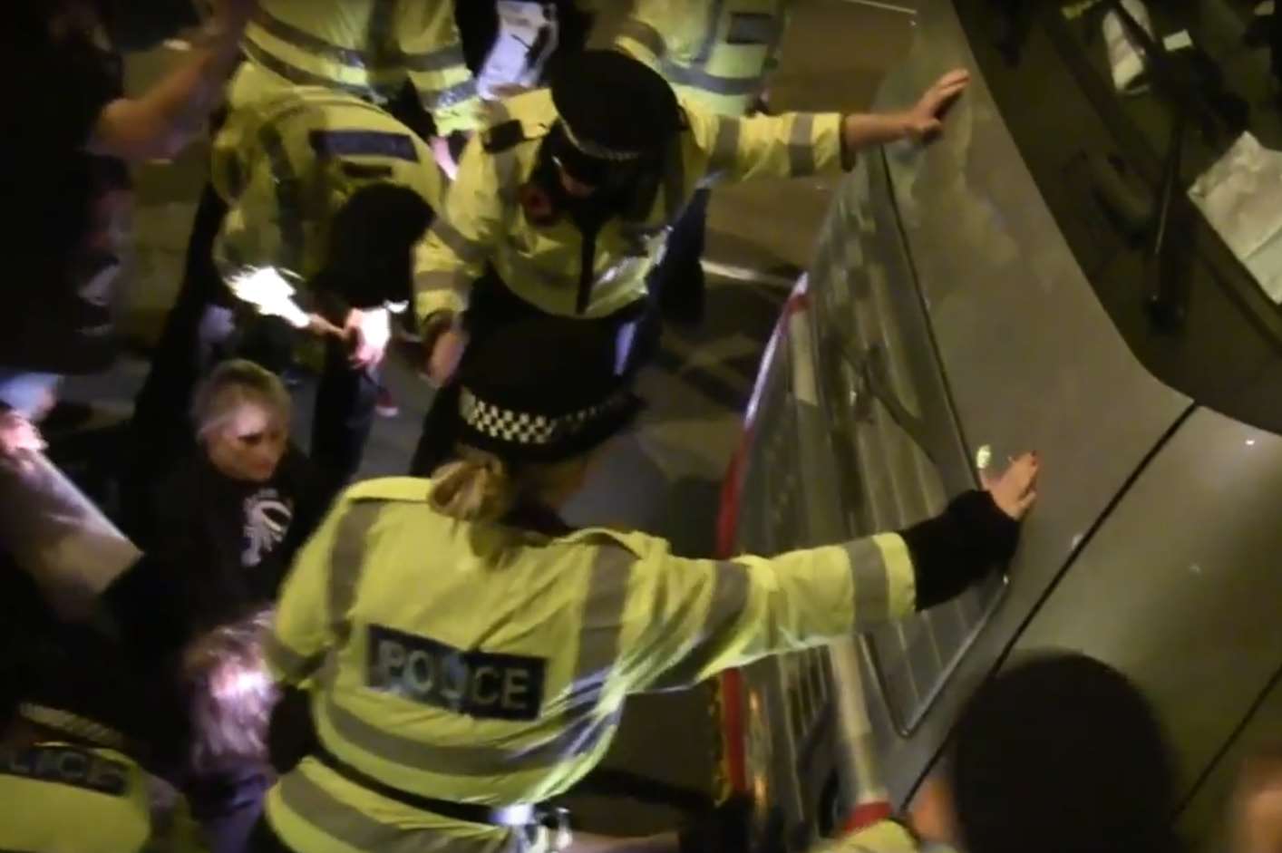 A woman sat in front of lorries carrying animal exports last night before being moved on by police