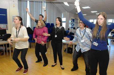 Students dance using a Wii