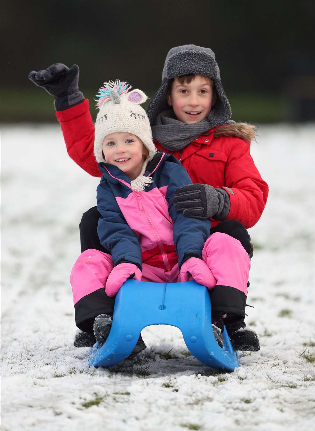 Daniel Brym, aged eight, and his sister Emma, four, sledging on Camp Hill, Woolton, Liverpool (Peter Byrne/PA)