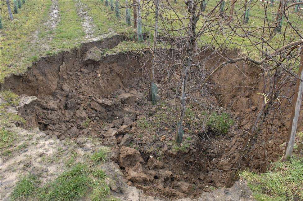 The aftermath left after the crater opened up at the farm