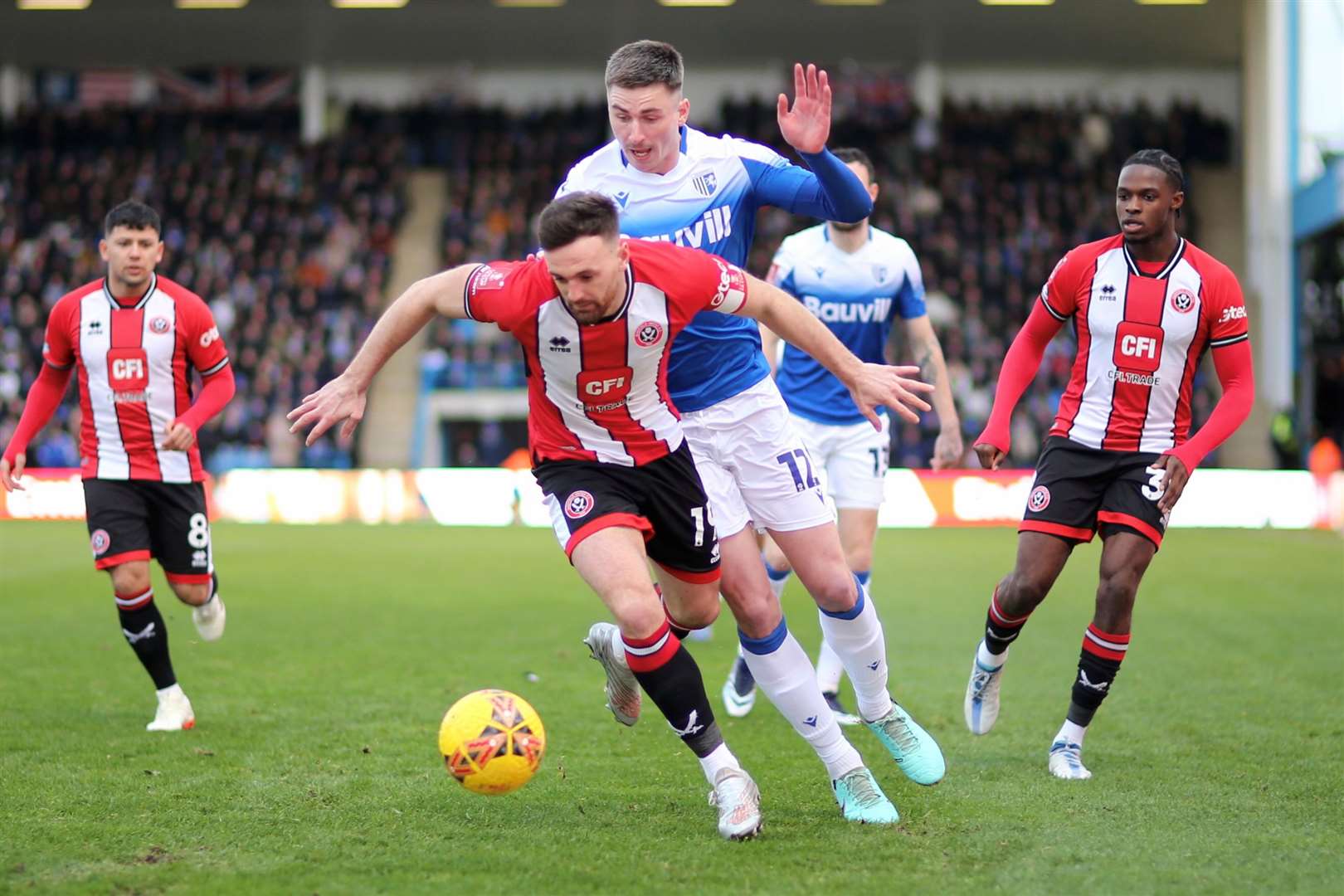 Oli Hawkins looks to win the ball for Gillingham Picture: @Julian_KPI