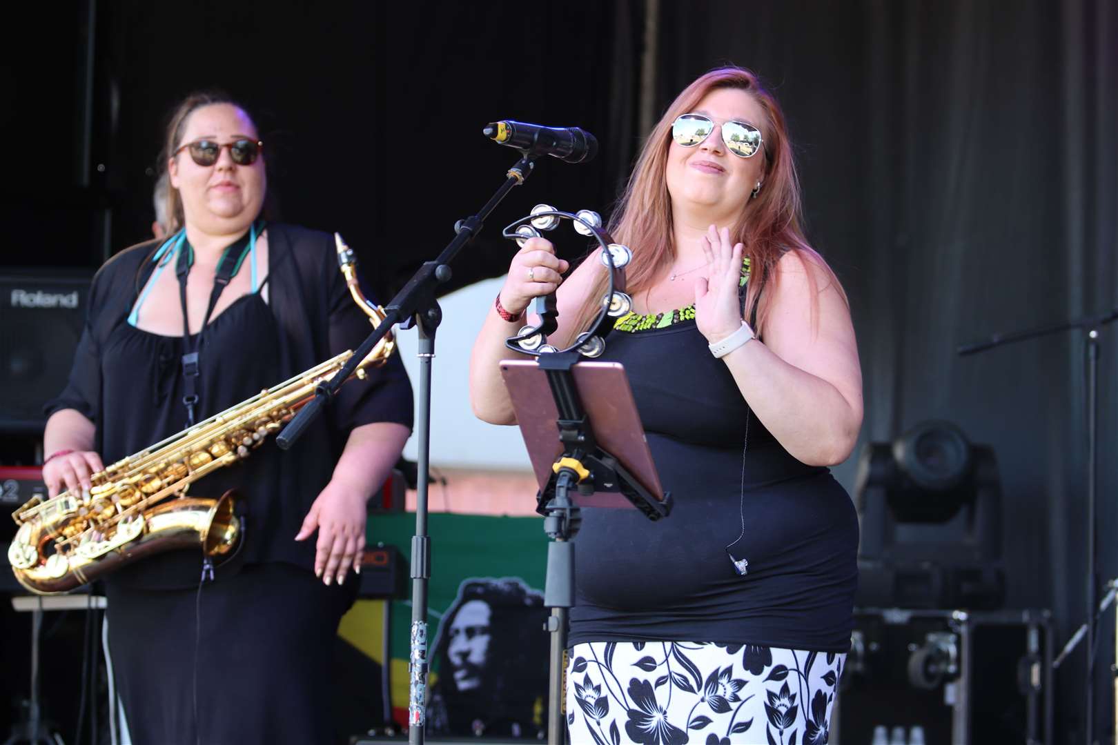 Helen Wimble, sax, and singer Ashleigh Kerrison from the Decades Showband performing at Woodfest, Woodcoombe Sports and Social Club, Murston. Picture: John Nurden (58491650)