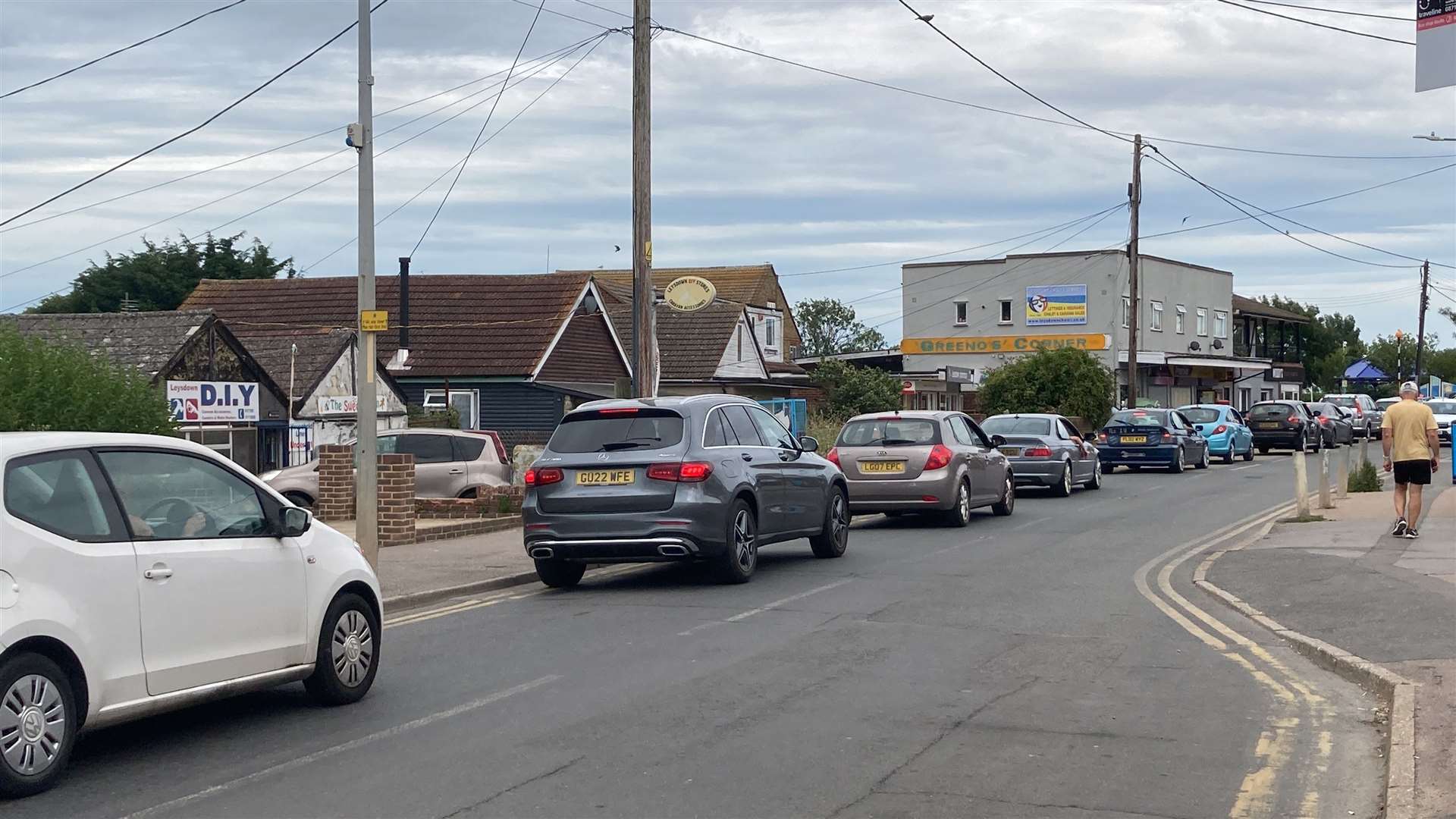 People can be seen queuing for water in Leysdown