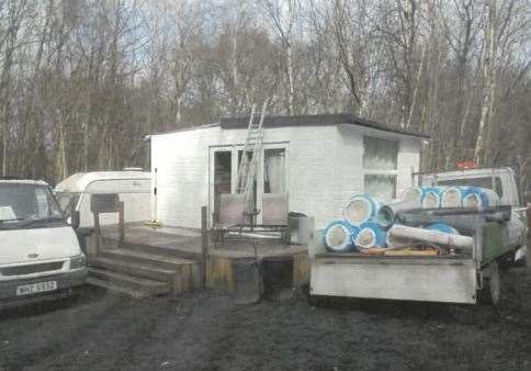 A utility building with raised decking building on the unauthrorised site in Fowler's Stone Wood. Photo: Gravesham council