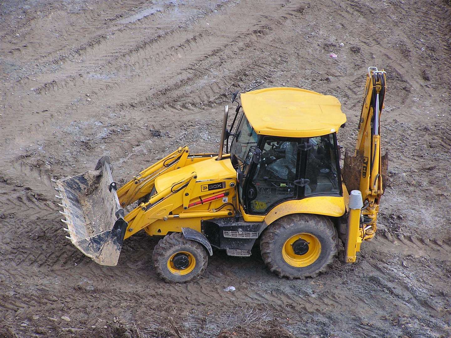 The JCB was driven into a hedge. Stock pic