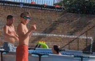 Bob Gartward, Tidus Gartward-Davidson, 15 and Leon, 11 enjoying the pool in the communal yard in Silverweed Road, Chatham. Picture: Chelsea Davidson