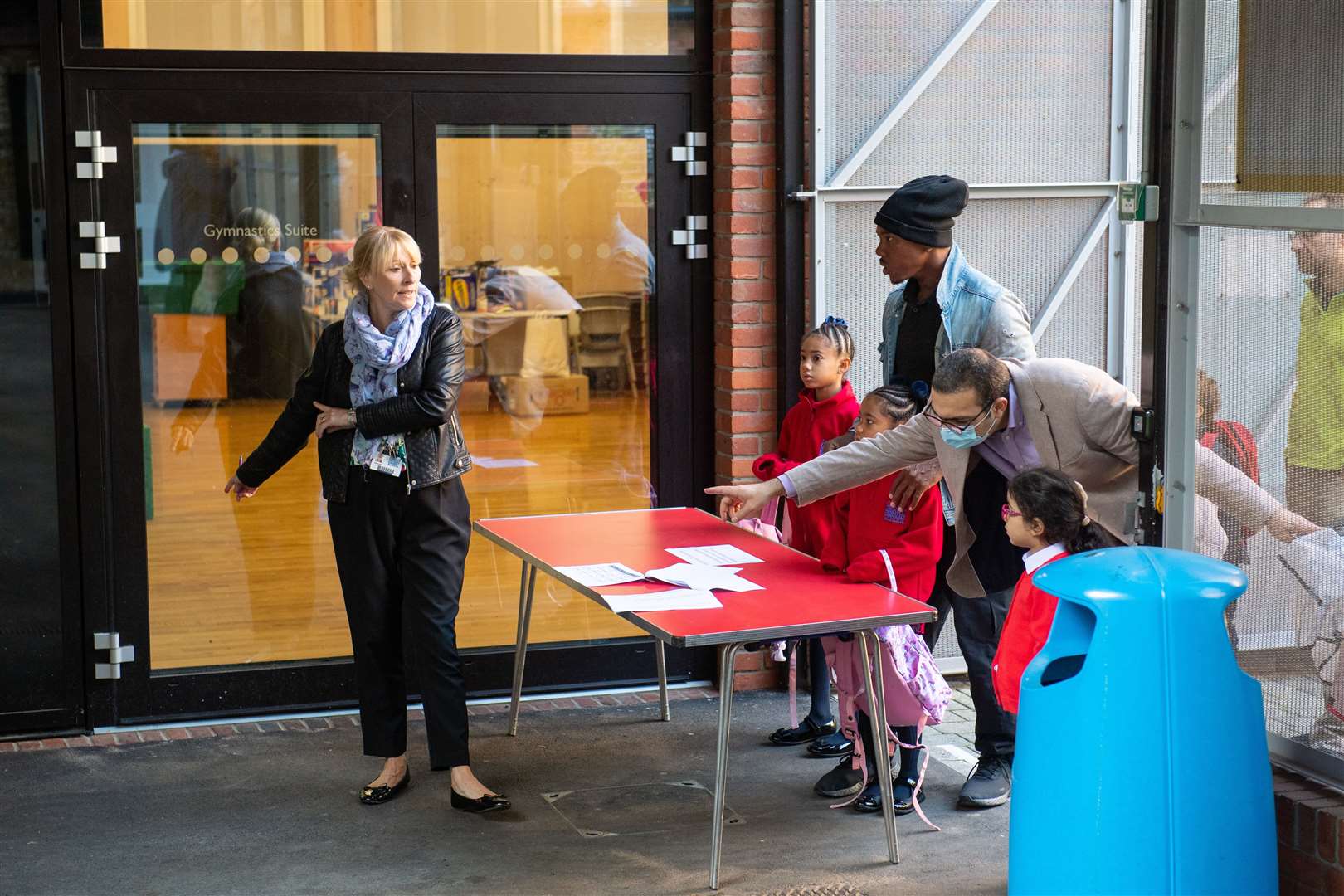 Parents drop off children off at Charles Dickens Primary School in south London on the first day back (Dominic Lipinski/PA)