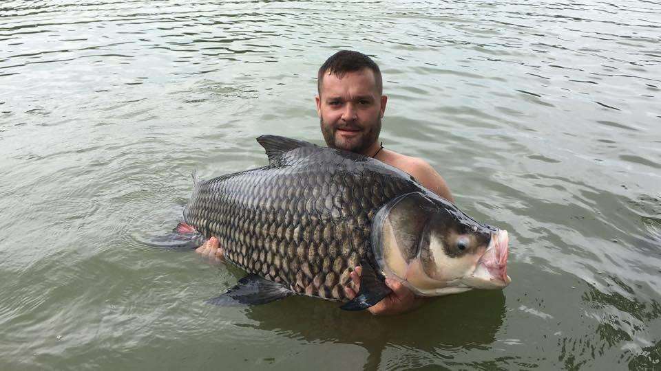 Kevin Rowlands holds up a catch at Gillhams Fishing Resort on Krabi