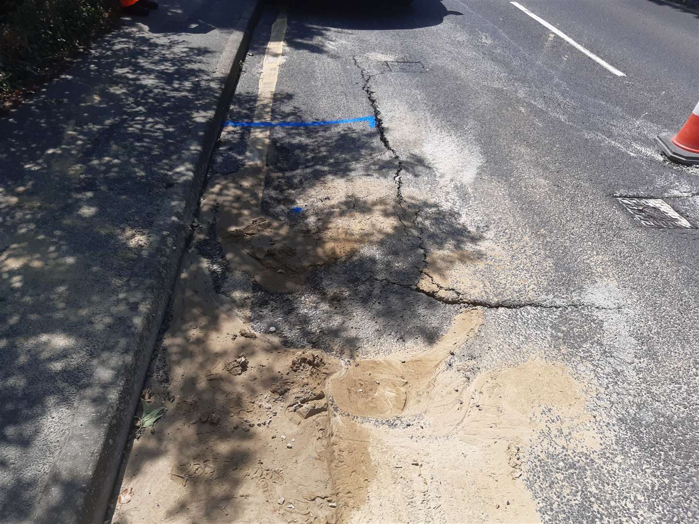 The unrepaired second burst main, near the railway bridge in Maidstone Road