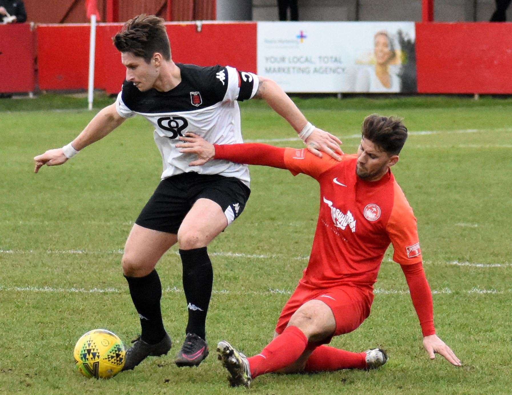 Faversham skipper Harry Harding comes up against Hythe player-manager James Rogers in Town's defeat in January. Picture: Randolph File