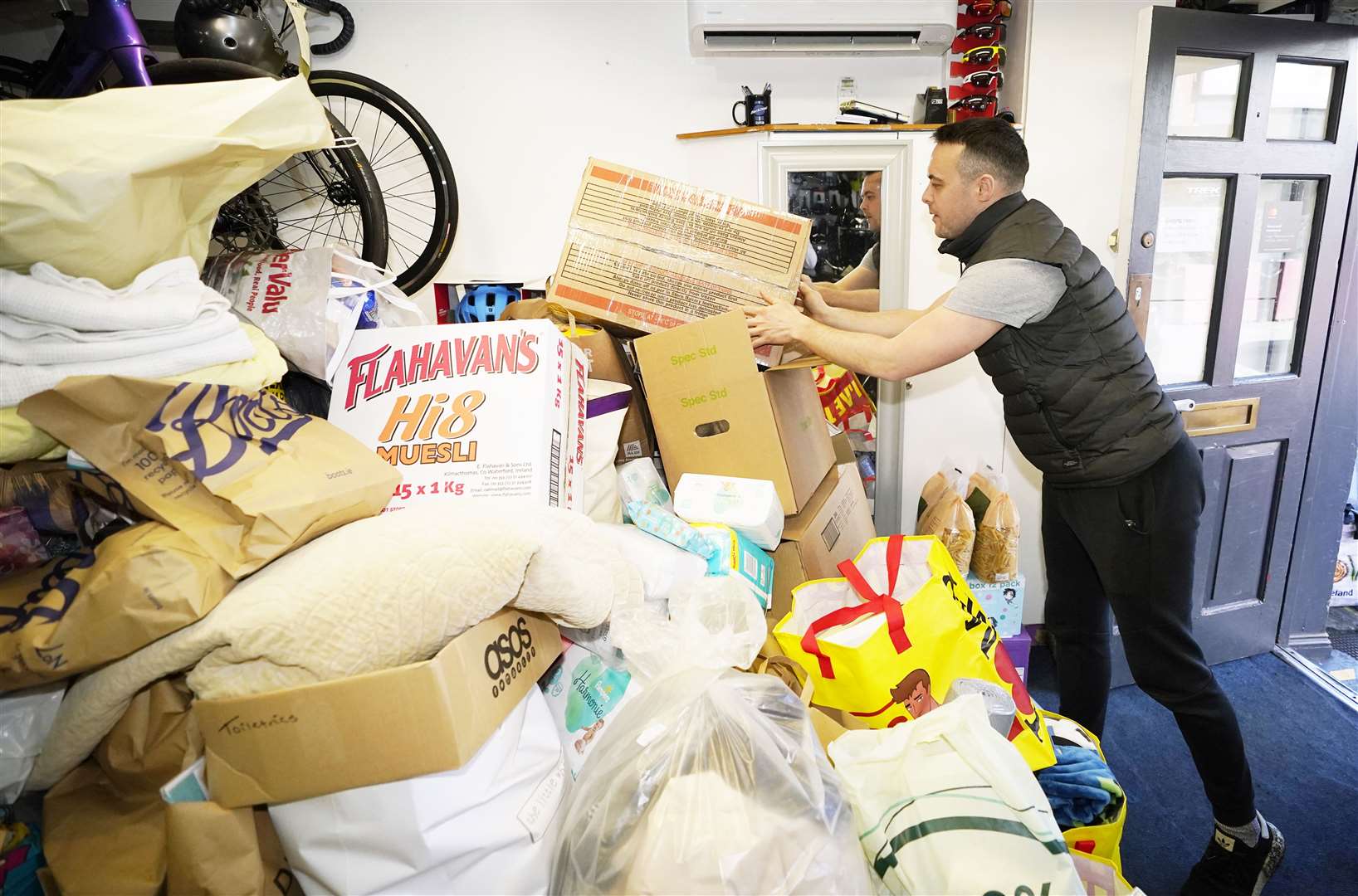 Ruairi Parsons organises donations for Ukrainian refugees at Donnybrook Bikes in Dublin (Niall Carson/PA)