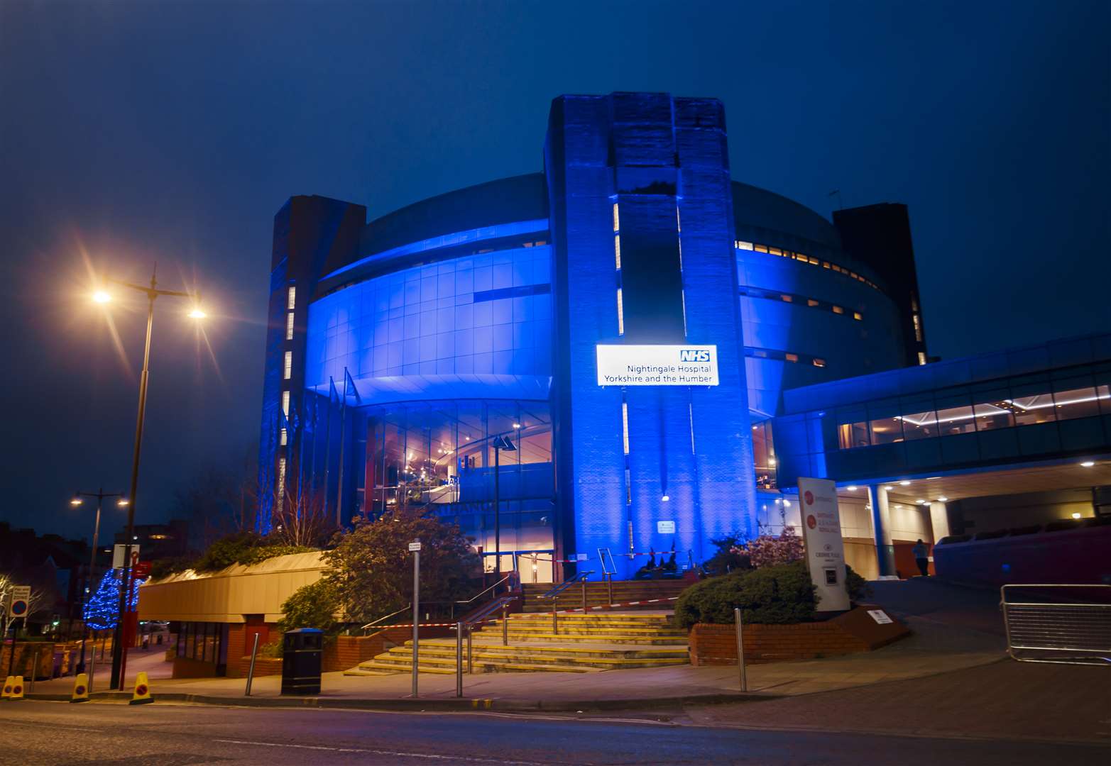 The temporary hospital was illuminated blue when it got darker (Danny Lawson/PA)