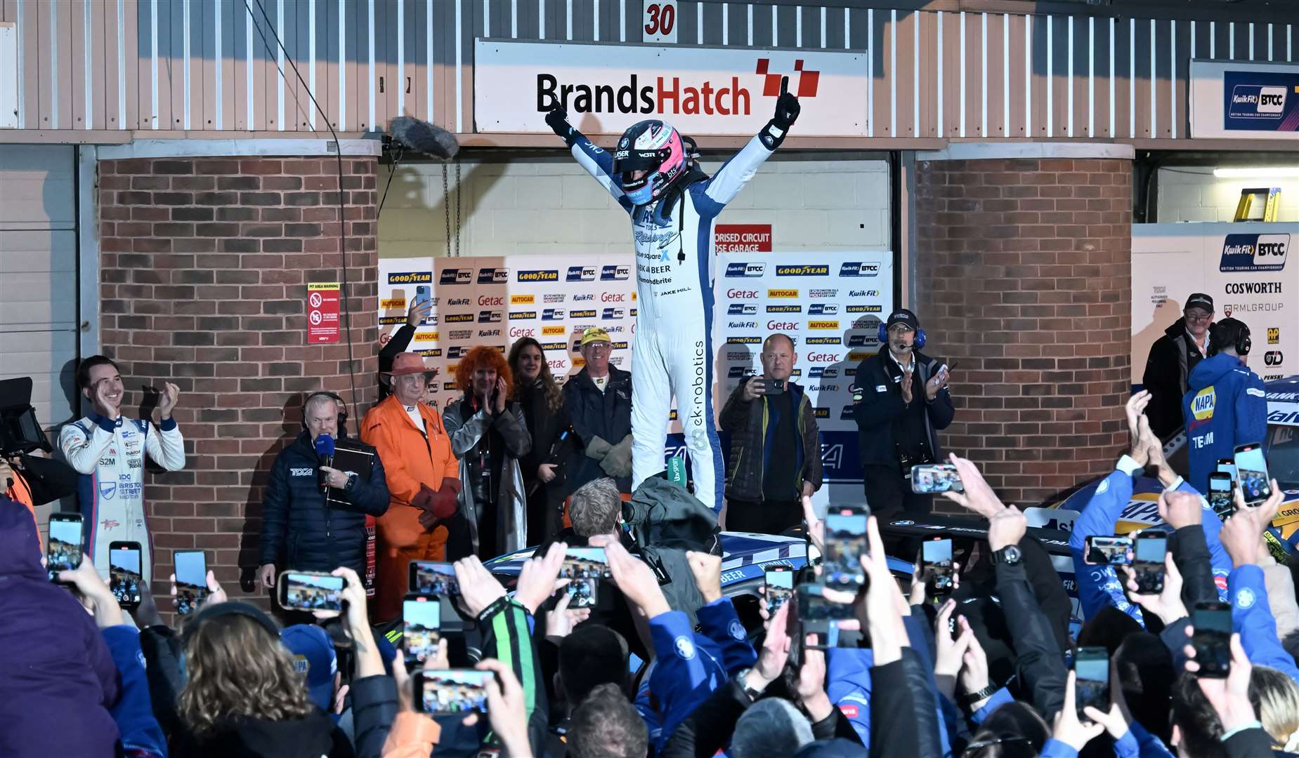 Jake Hill celebrates his maiden BTCC crown as Tom Ingram, left, applauds his long-time rival. Picture: Simon Hildrew