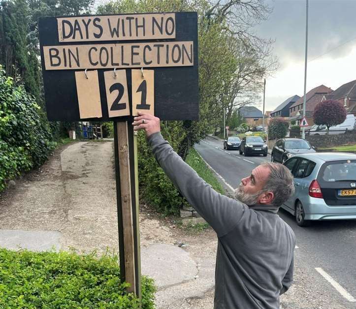 Sittingbourne's Andy Duffus put a sign outside his home to show how long he'd had to wait for collections. Picture: Becci Duffus