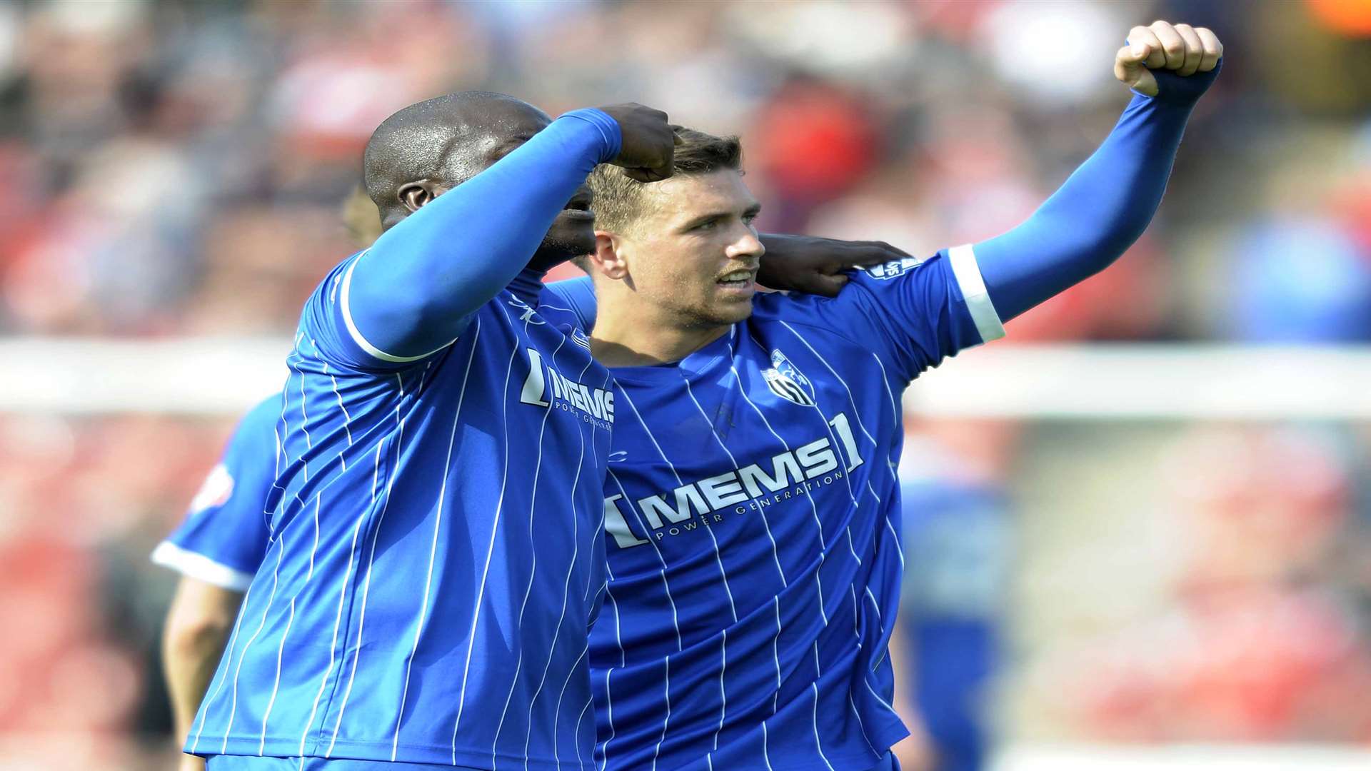 Cody McDonald celebrates with Adebayo Akinfenwa Picture: Barry Goodwin