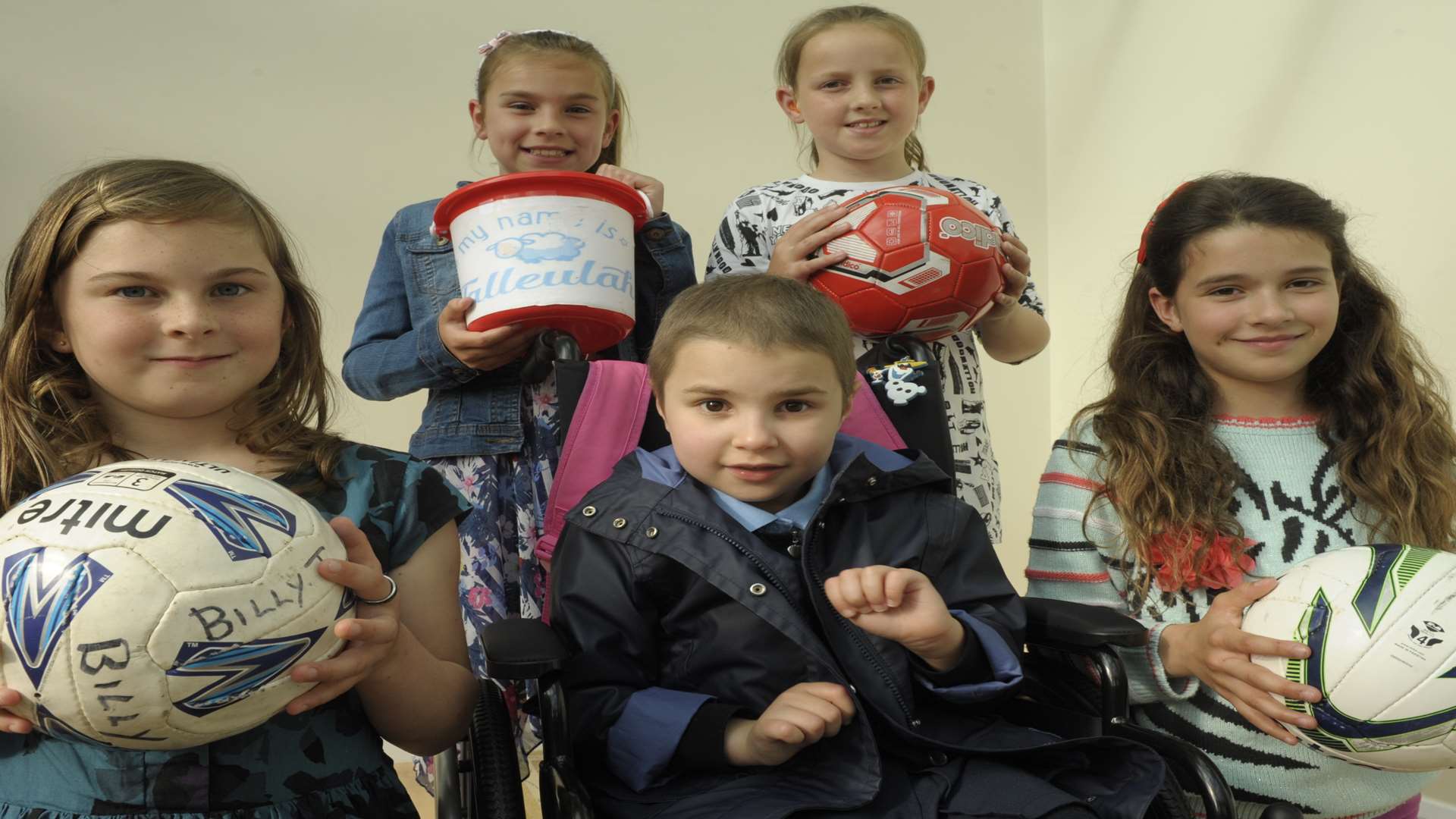 Ruby Govier, 7, Annie Rayfield, 9, Megan Alabaster, 10 and Molly Tuffin, 10, with Talleulah.