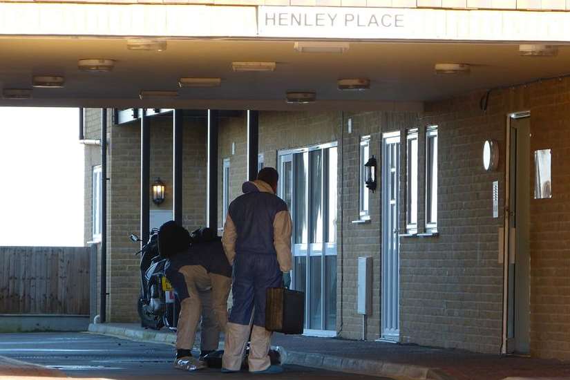 Officers search the area outside Henley Place in Teynham. Picture: @Kent_999s on Twitter