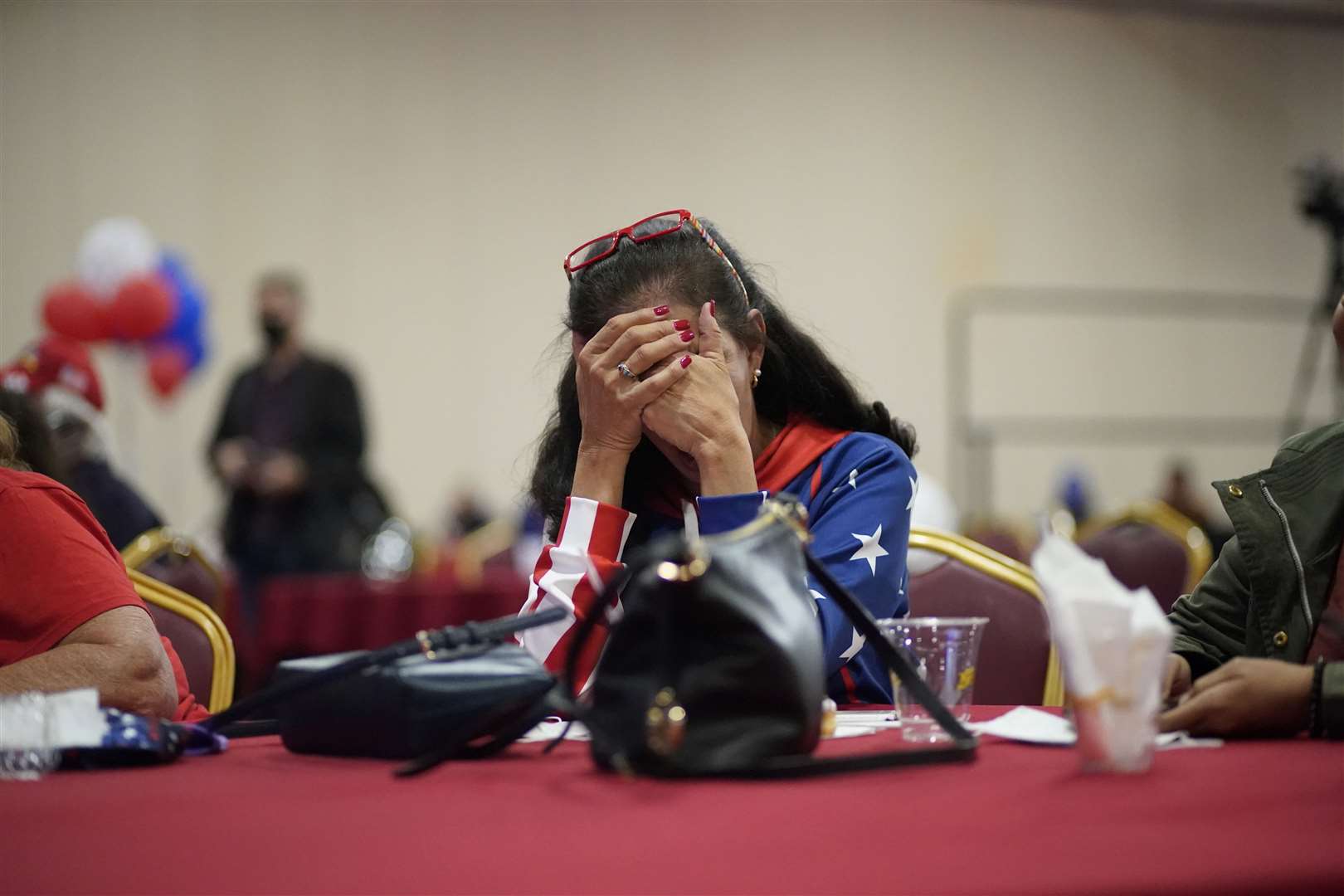 Trump supporter Loretta Oakes reacts while watching returns in favour of Joe Biden, at a election-night watch party in Las Vegas. (John Locher/AP)