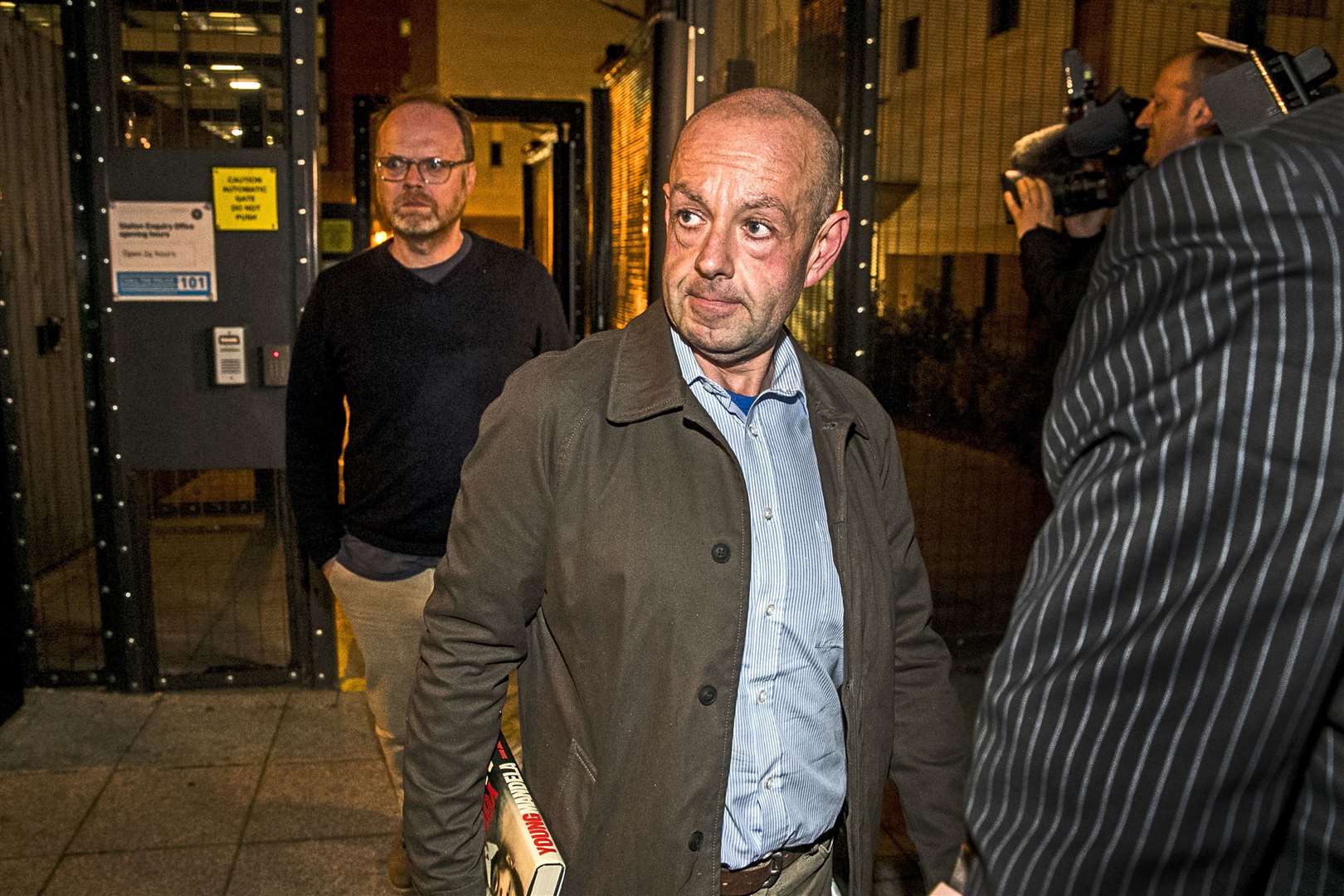 Investigative journalists Trevor Birney (left) and Barry McCaffrey (right) leave Musgrave Street police station in Belfast after their arrests in 2018 (PA).