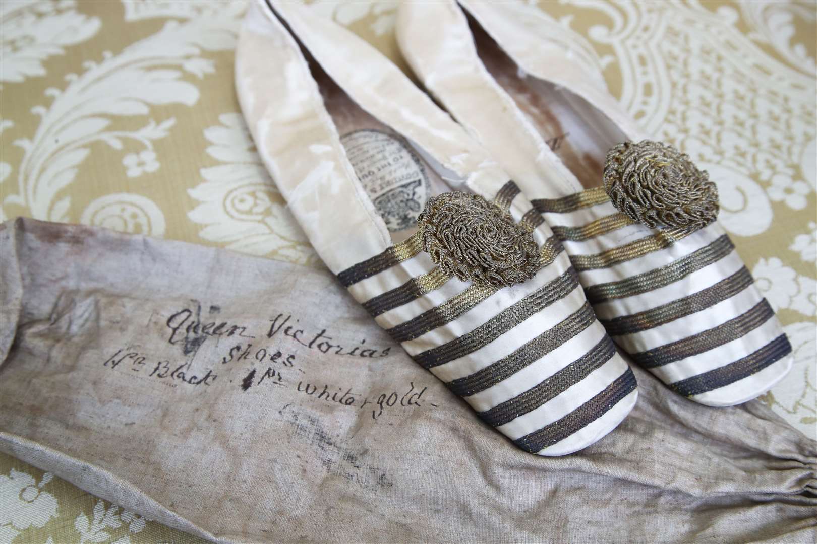 A pair of ballet-style slippers which belonged to Queen Victoria (Gareth Fuller/PA)