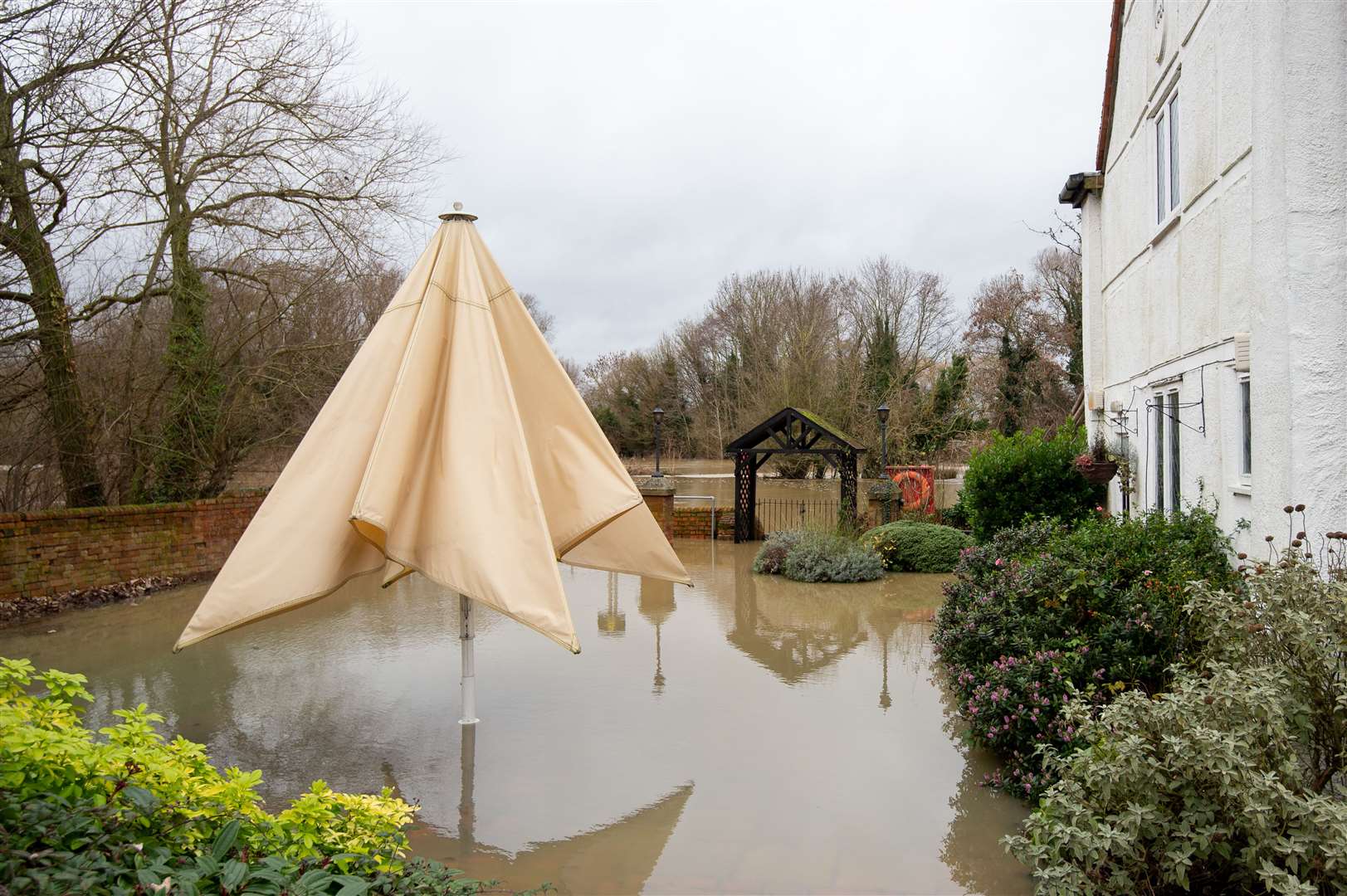 Floodwater surrounds The Barn Hotel in Bedford (Joe Giddens/PA)