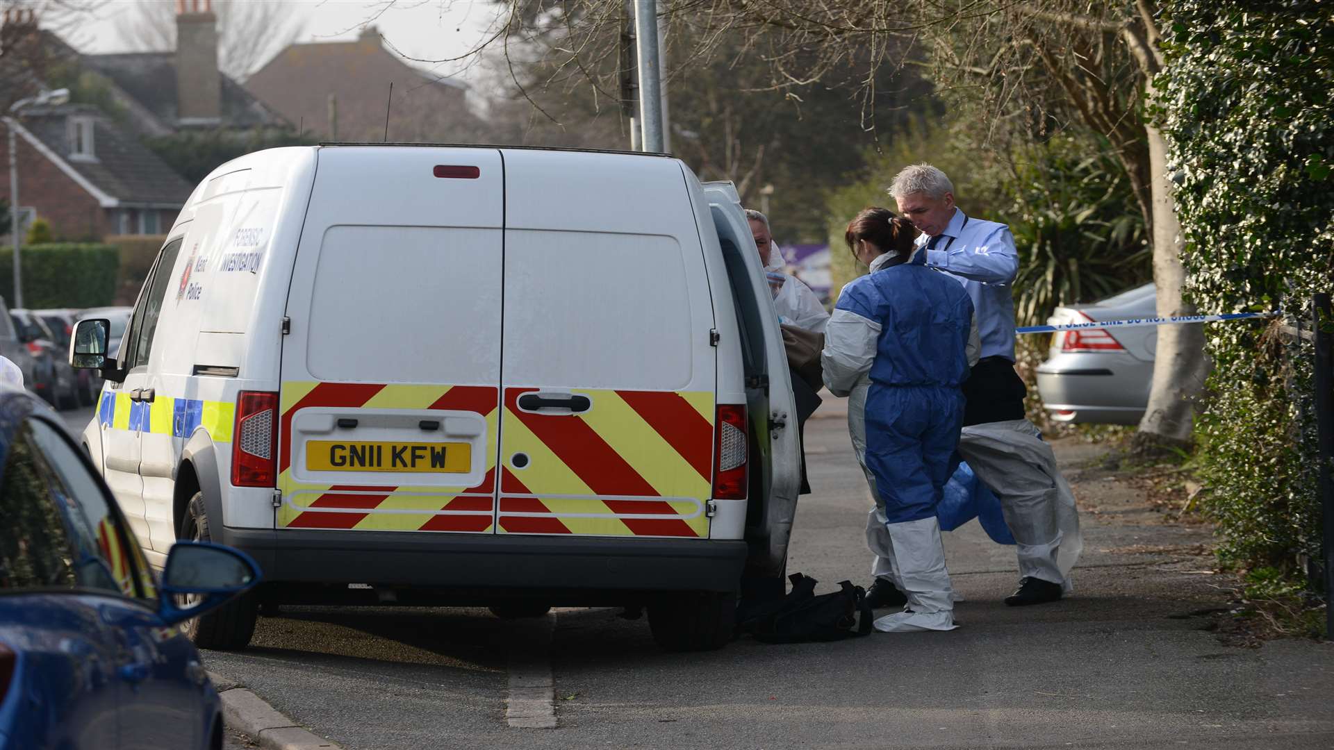 Officers near a police forensic van outside the park. Picture: Gary Browne