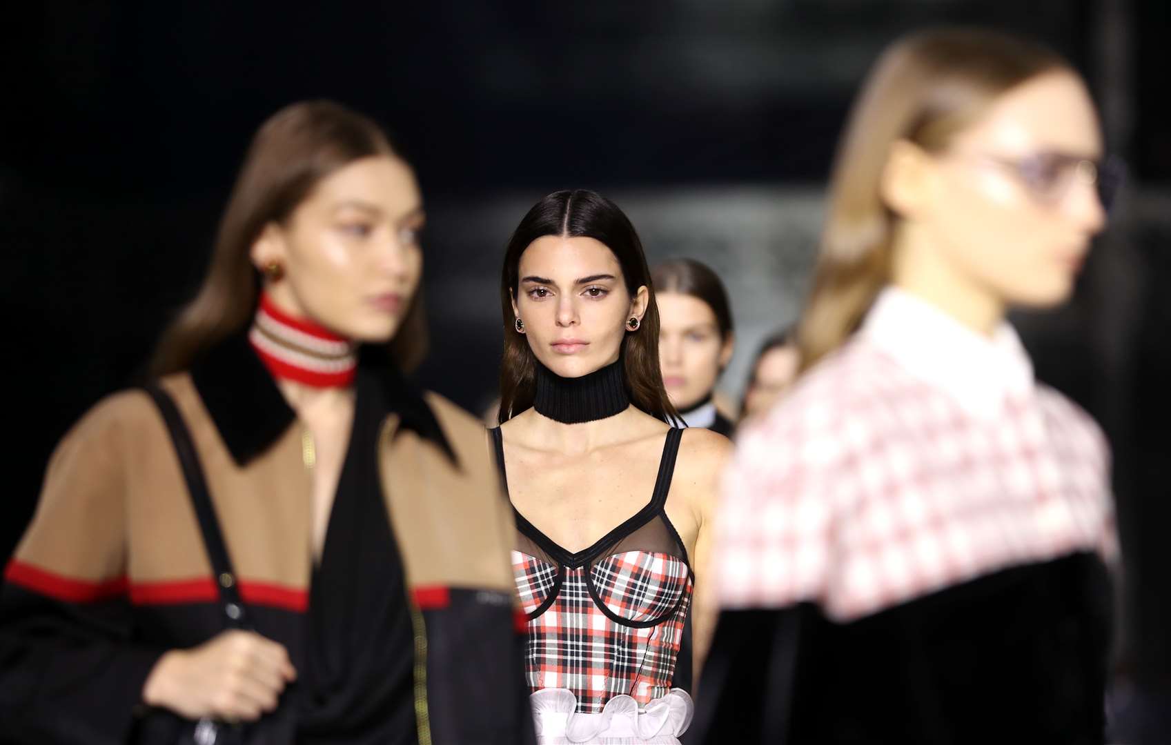 Gigi Hadid and Kendall Jenner during the Burberry show at last year’s London Fashion Week (Aaron Chown/PA)