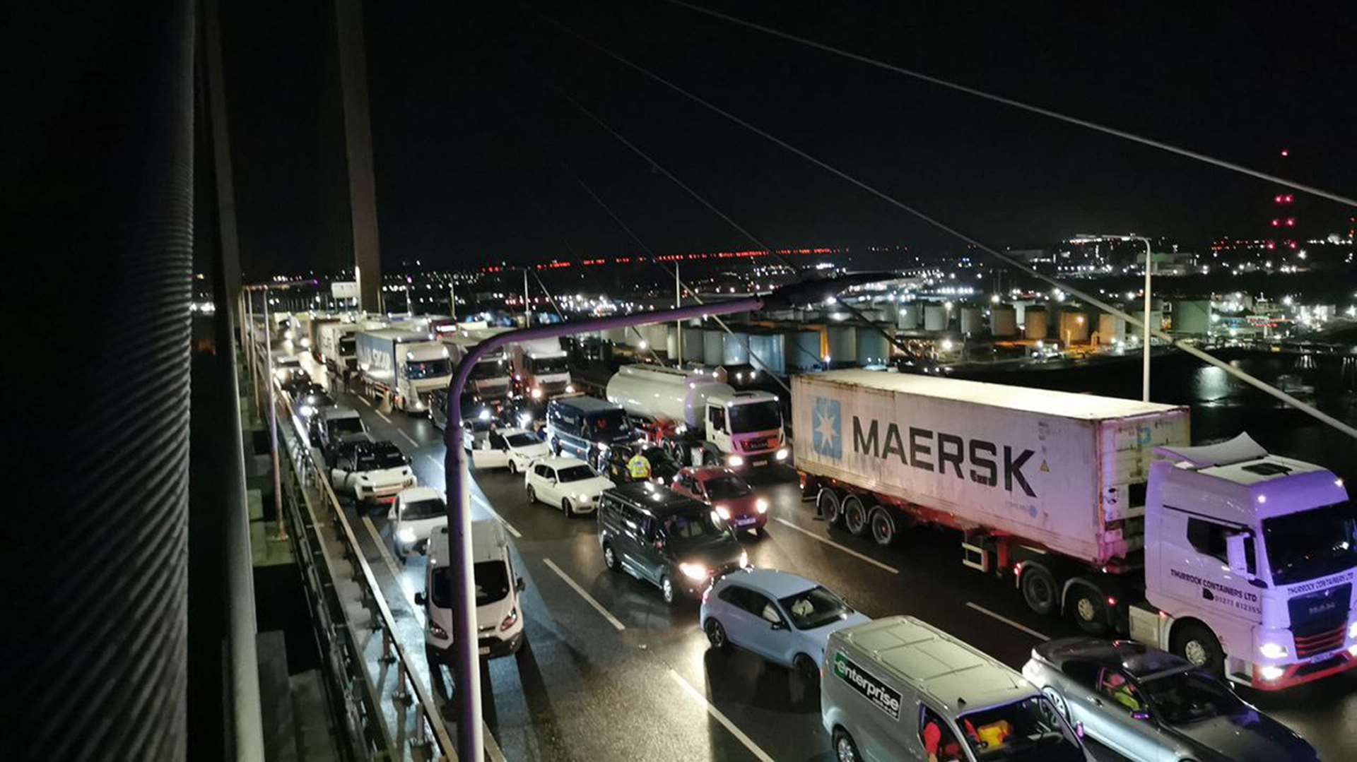 Traffic stopped after two activists scaled the Queen Elizabeth II Bridge at the Dartford Crossing (Just Stop Oil)