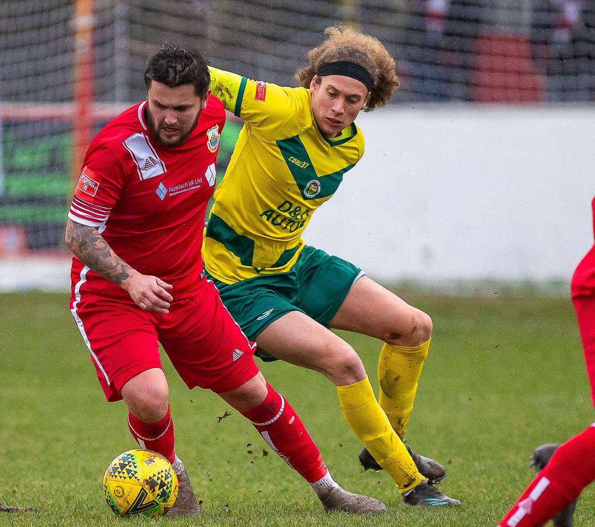 New Whitstable signing George Monger turns away from Ashford's Jarred Trespaderne during the Oystermen's defeat last weekend. Picture: Les Biggs