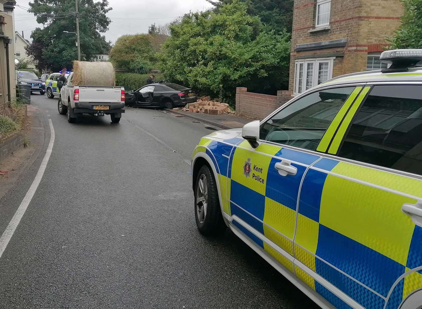 Police are at the scene of a crash in South Street, Meopham, after a car ploughed into a wall. Picture: Dave Dkb Barton