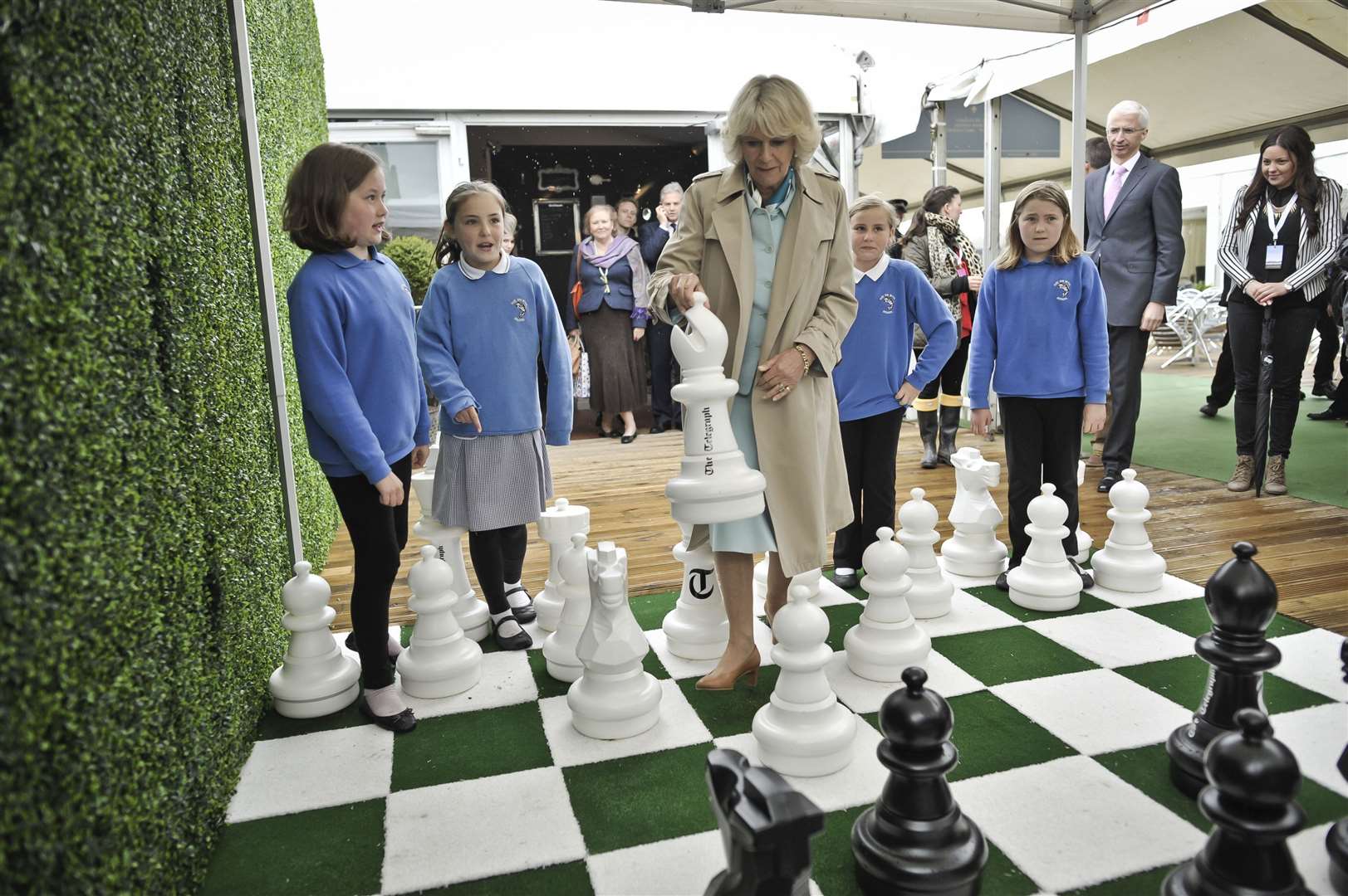 The Duchess of Cornwall plays a game of outdoor chess at the Hay Festival in 2013 (Ben Birchall/PA)