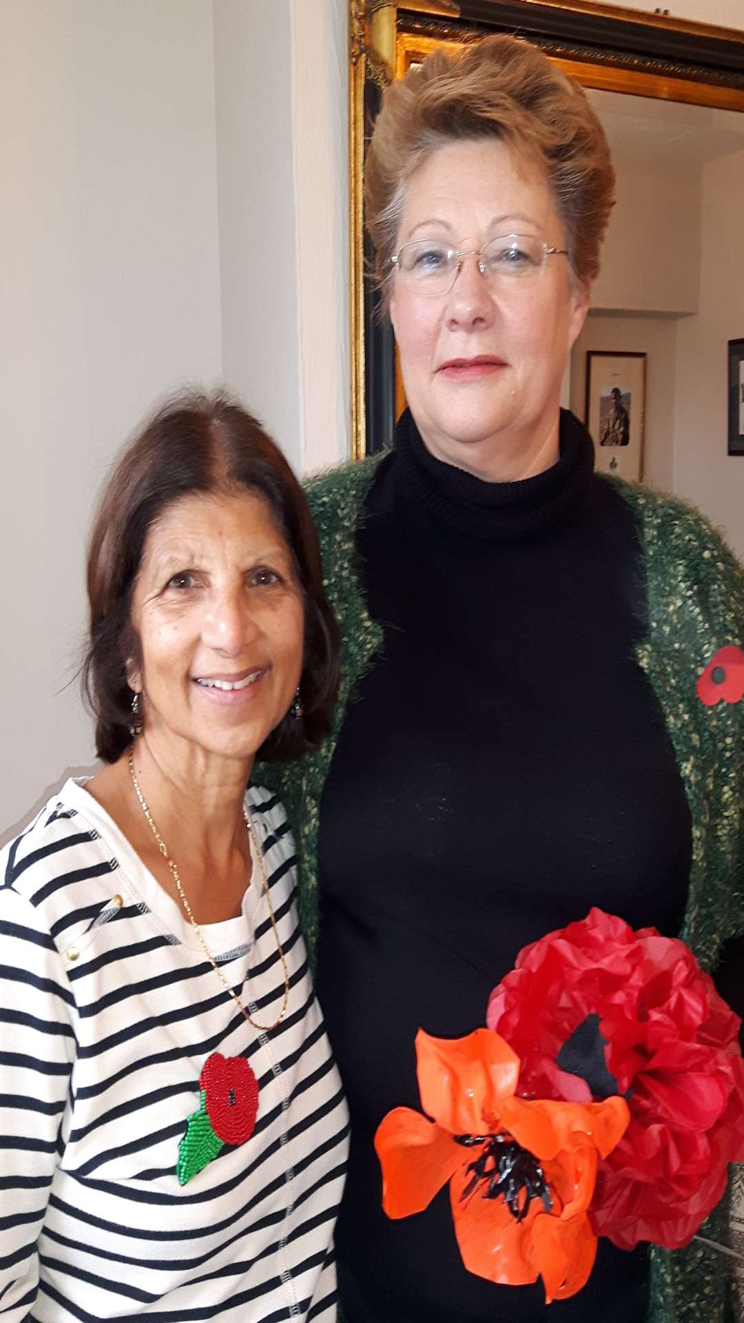 Masheeda Downing with the Rev Cathy Sigrist and some of the poppies that have been made