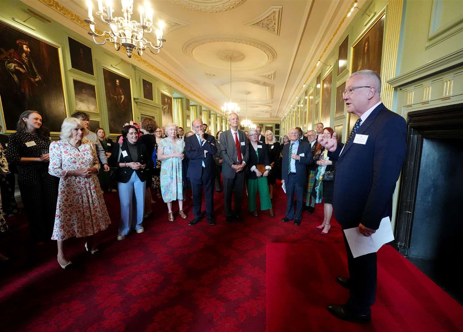 Camilla listens as broadcaster Allan Little (right) speaks at a celebration at the Palace of Holyroodhouse in Edinburgh for those who promote Scottish literacy (Andrew Milligan/PA)