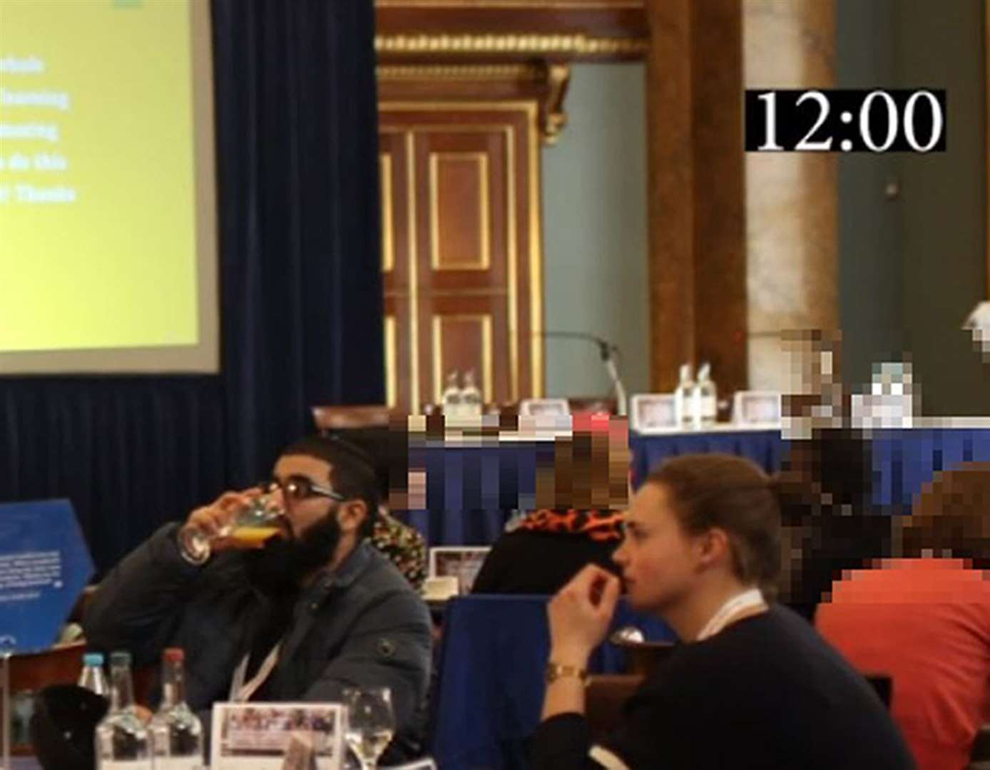 Usman Khan and Saskia Jones sit at a table together at a prisoner rehabilitation event near London Bridge (Met Police/PA)