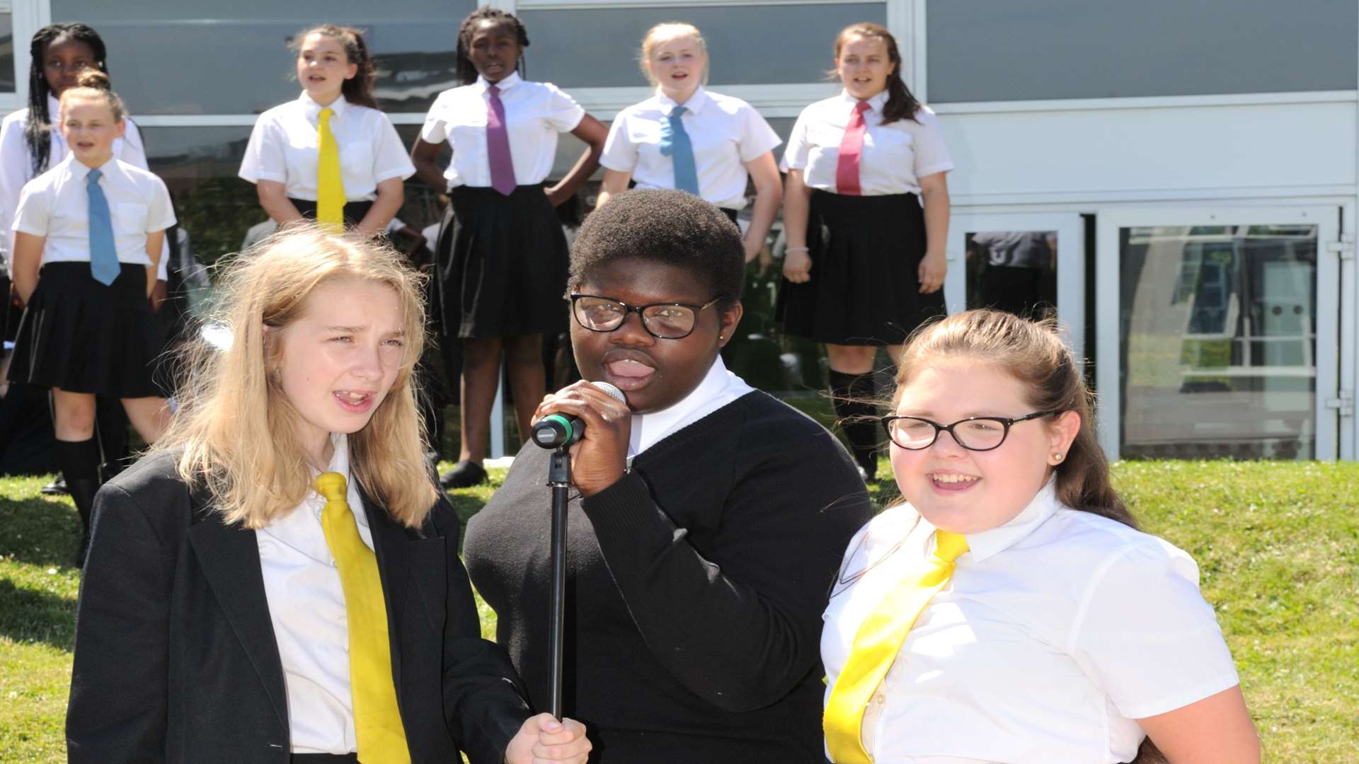 The youngsters sang and performed on the school field. Picture: Simon Hildrew