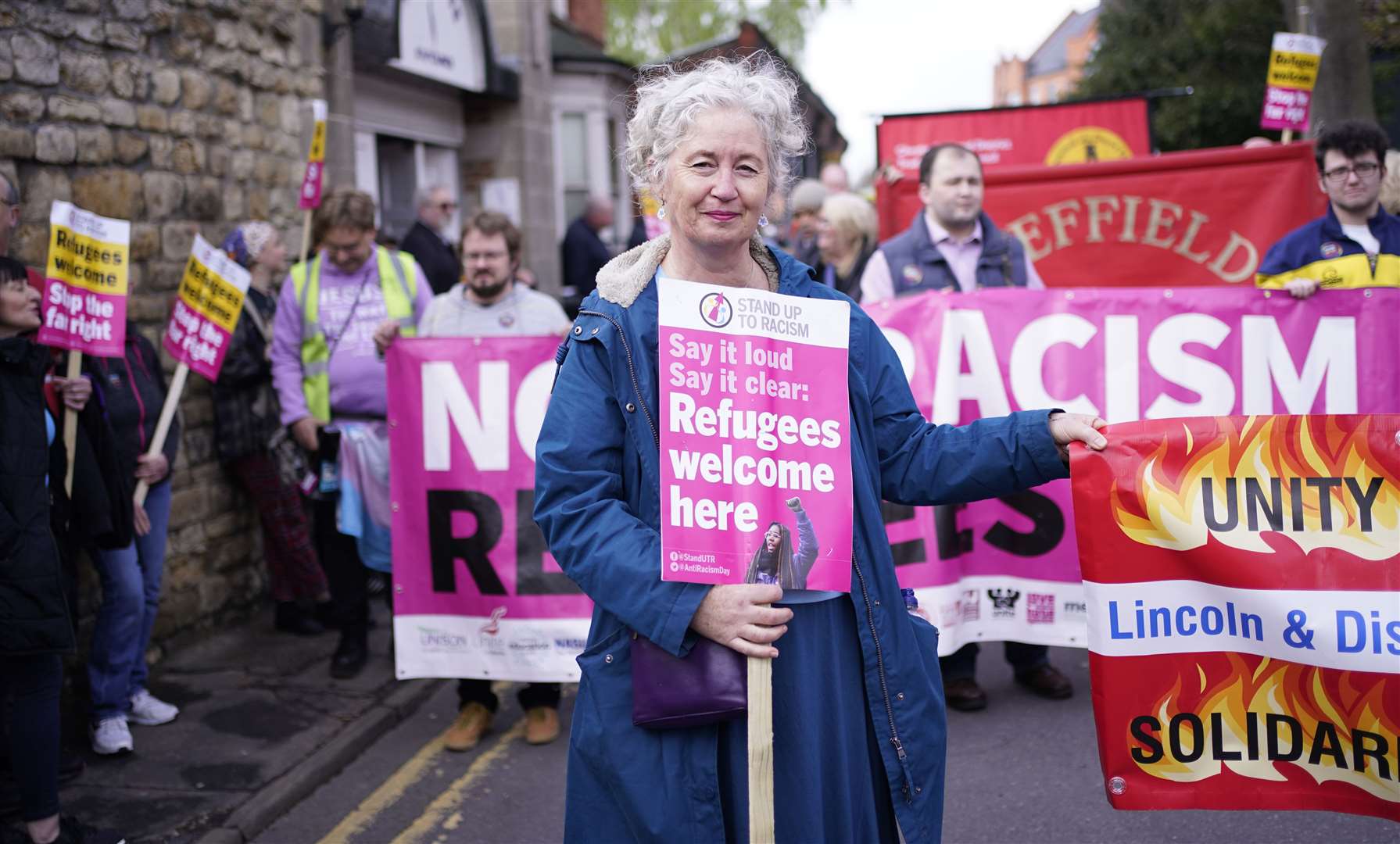 Stand Up To Racism marchers at the start of their rally (PA)